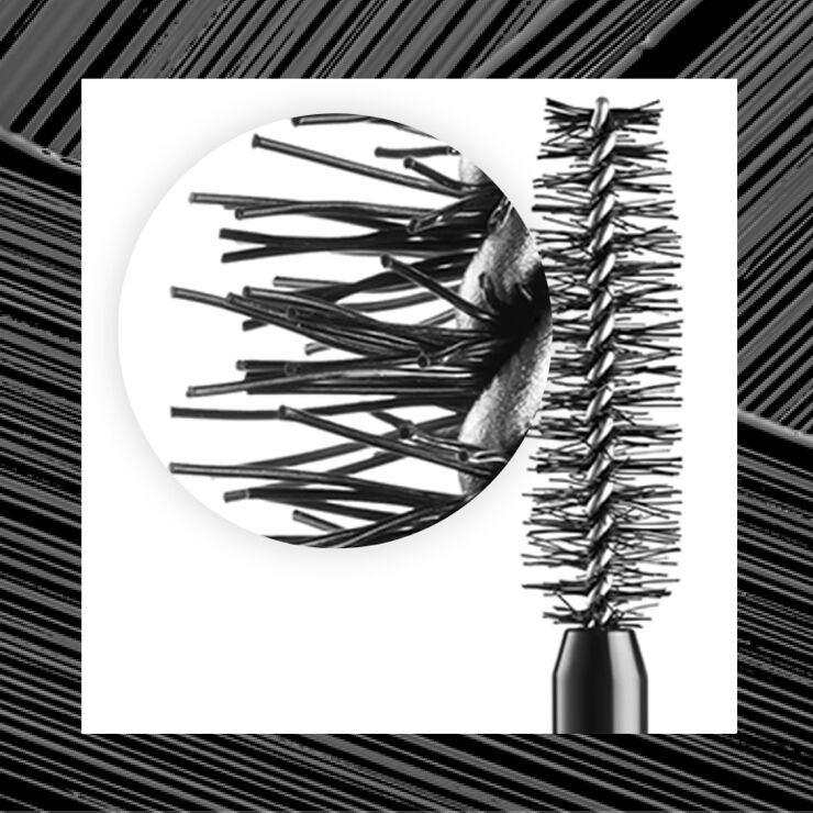 Close-up of a black mascara wand showing its bristles, emphasizing the unique texture and design for applying mascara.