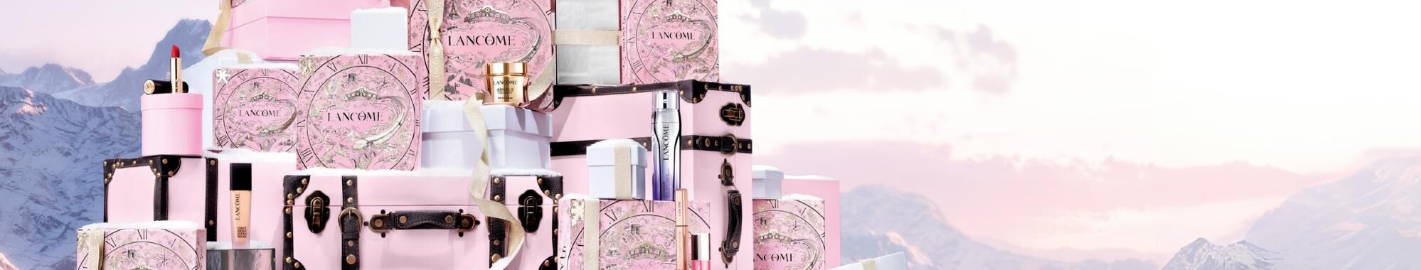 Three Lancome skincare products displayed on a gradient background, featuring sleek, modern packaging.