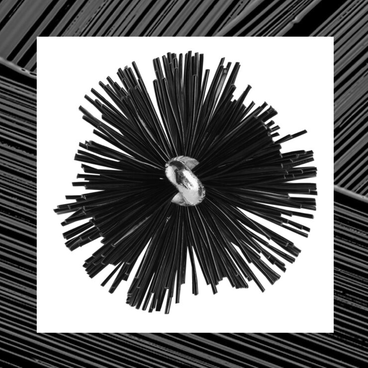 A geometric abstract design featuring a cluster of black, elongated shapes radiating outwards from a central silver sphere. The background is a stark white, highlighting the contrast between the shapes and the backdrop.